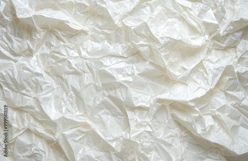 The background is made up of empty crumpled cellophane paper. It is beige white in color.