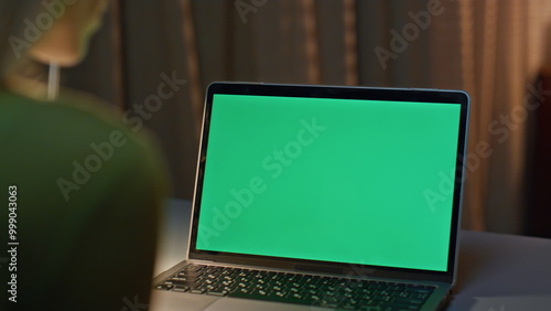 Bild auf Leinwand Late worker looking chroma key laptop working on project remotely close up