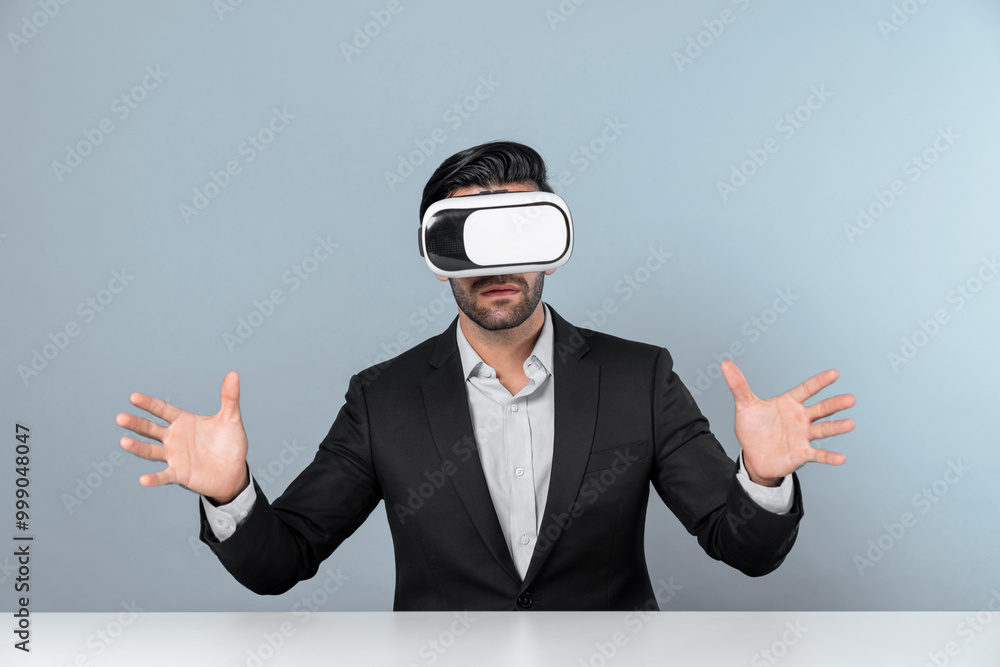 Smart businessman sitting while pointing and choosing data analysis by using technology innovation. Professional caucasian project manager using virtual reality glasses and VR goggles. Deviation. Smart businessman sitting while pointing and choosing data analysis by using technology innovation. Professional caucasian project manager using virtual reality glasses and VR goggles. Deviation.
