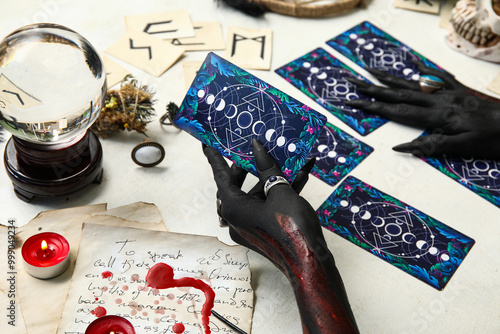 Bloody black witch hands wi...