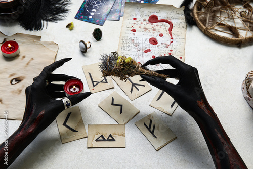 Bloody black witch hands wi...