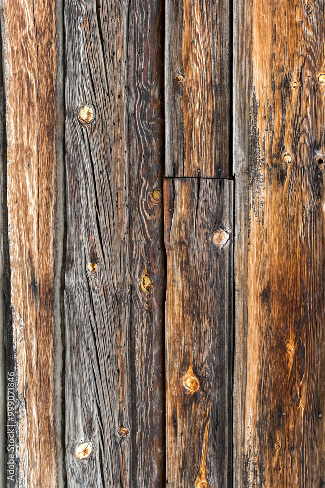 A close-up shot of a rustic wooden texture featuring aged wooden planks. The surface reveals the natural grain patterns, knots, and weathered lines that highlight the character of the wood. A close-up shot of a rustic wooden texture featuring aged wooden planks. The surface reveals the natural grain patterns, knots, and weathered lines that highlight the character of the wood.