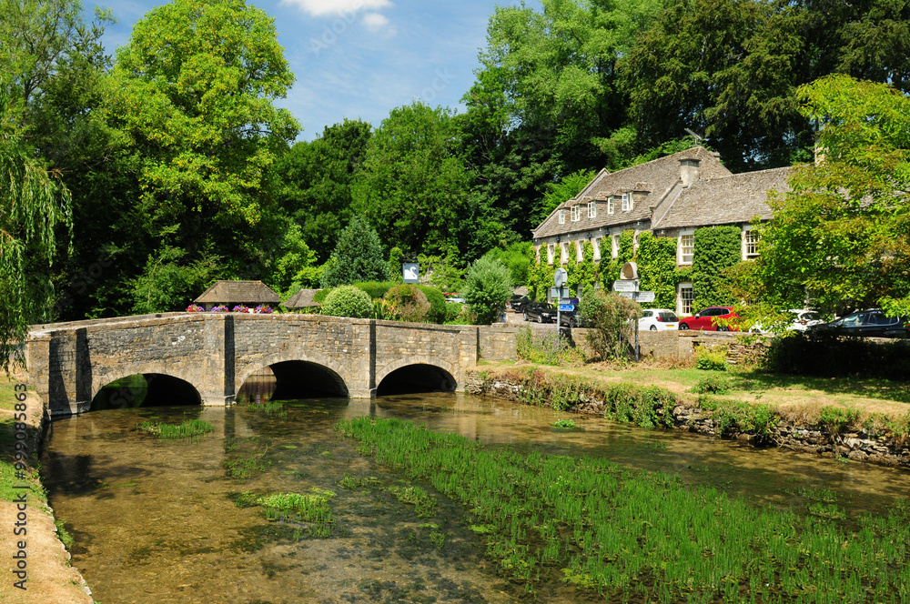 Idyllic Coln River In Bibury Cotswolds England Great Britain On A Beautiful Summer Day With A Clear Blue Sky Idyllic Coln River In Bibury Cotswolds England Great Britain On A Beautiful Summer Day With A Clear Blue Sky