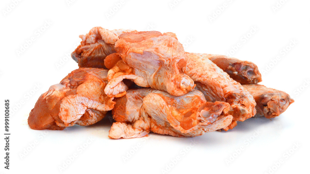 Raw chicken meat with bone on a white background
