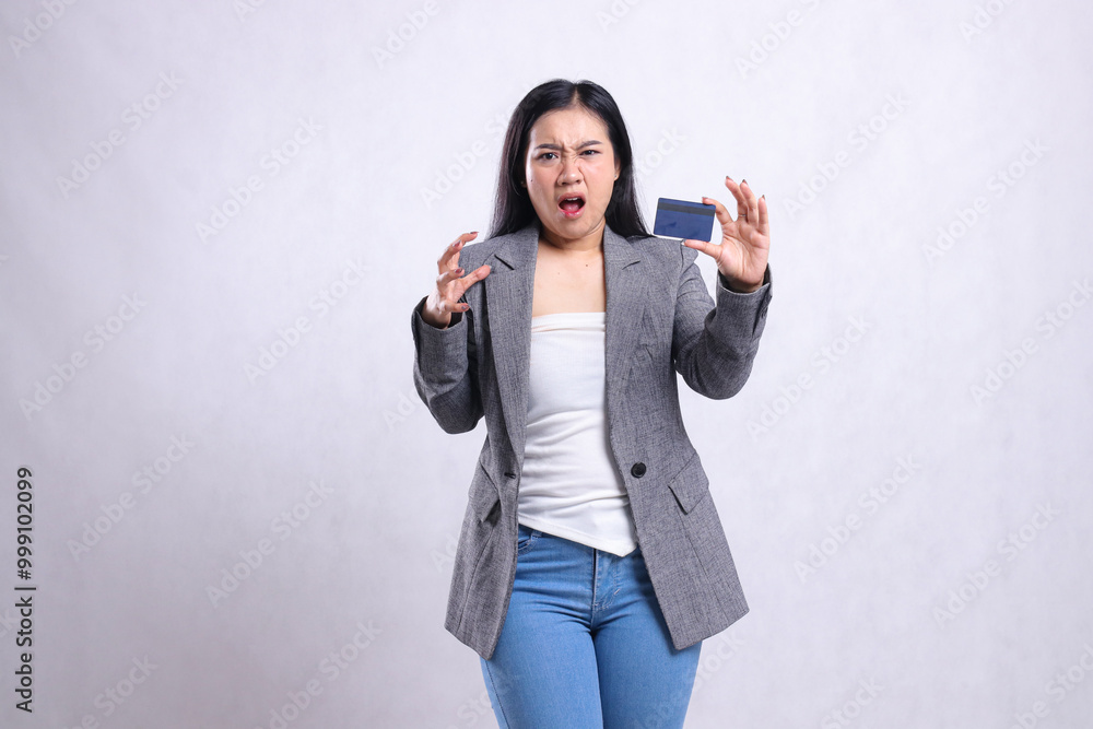 expression of mature beautiful office woman asia very annoyed hand sign of annoyance and hold credit debit member card wearing gray suit isolated on white background. for promotional , transaction expression of mature beautiful office woman asia very annoyed hand sign of annoyance and hold credit debit member card wearing gray suit isolated on white background. for promotional , transaction
