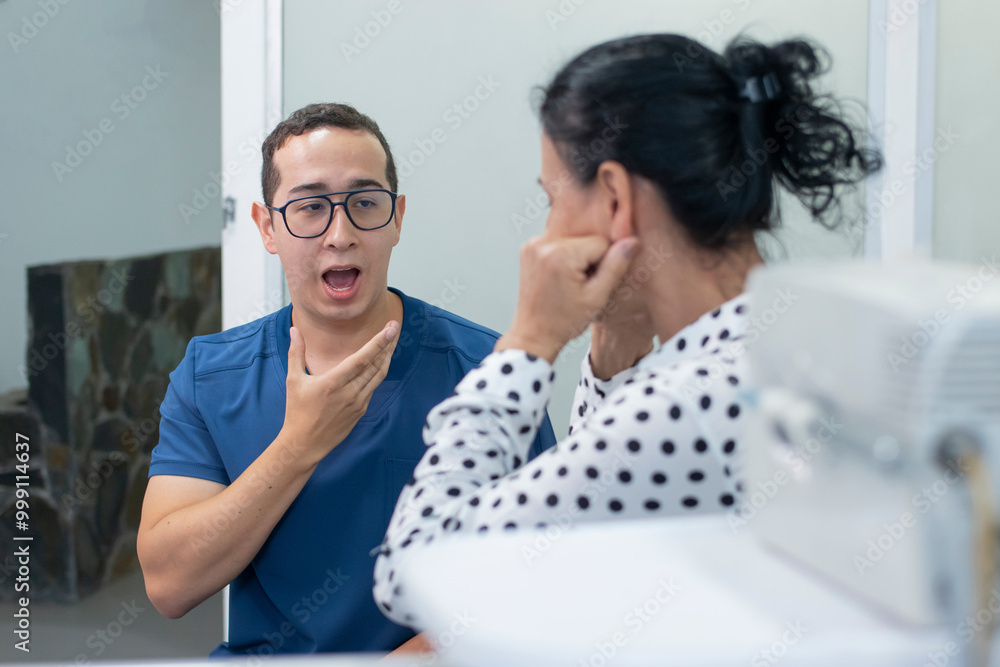 Dentist asking an adult female patient to open her mouth Dentist asking an adult female patient to open her mouth