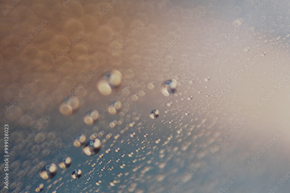 Macro shot of water droplet on reflective surface as background Macro shot of water droplet on reflective surface as background