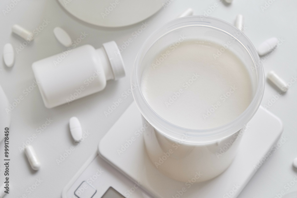Whey protein and supplements on white background. Whey protein and supplements on white background.