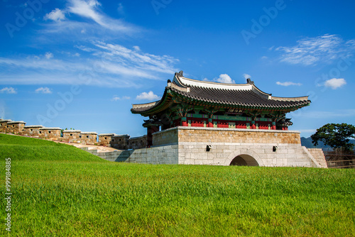 Wolgot Dondae, Ganghwa-gun, Incheon, South Korea - September 4, 2020: Lawn and stonewall of Johaelu Gate.  Dondae is a flat land that stands out higher than the ground photo