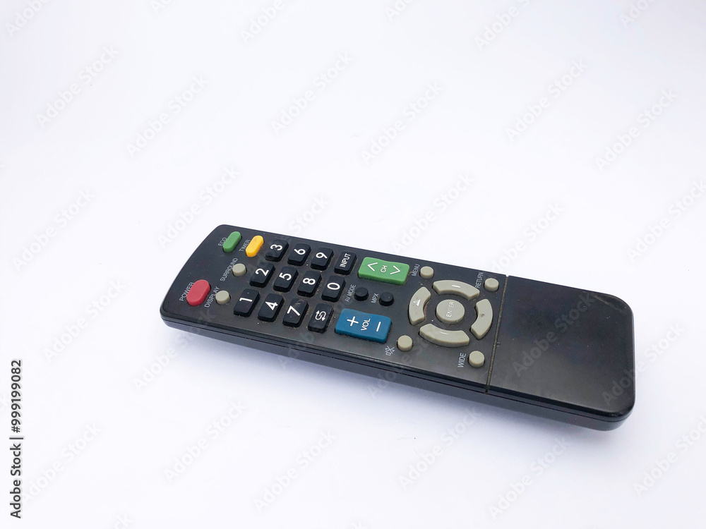 black tv remote with colored buttons isolated on a white background black tv remote with colored buttons isolated on a white background