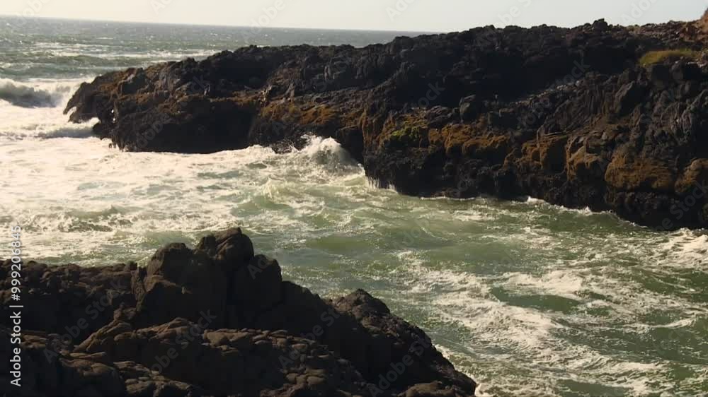 Rugged Inlet at Devil’s Churn with Ocean Waves Pounding the Rocks in Oregon, USA Rugged Inlet at Devil’s Churn with Ocean Waves Pounding the Rocks in Oregon, USA