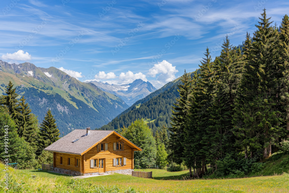 A picturesque wooden cabin nestled in a lush green valley, surrounded by majestic mountains and a clear blue sky. A picturesque wooden cabin nestled in a lush green valley, surrounded by majestic mountains and a clear blue sky.