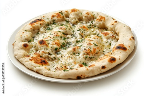 Crispy naan with butter and herbs on a wooden plate, isolated on a white background.