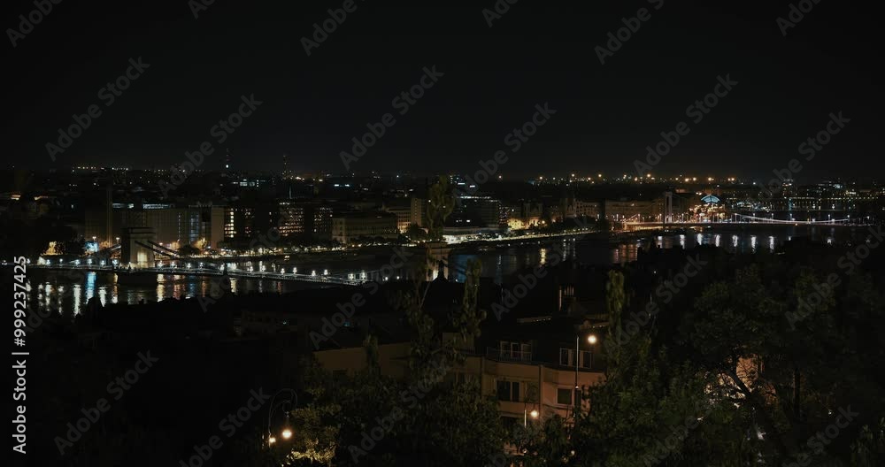 Night view of Budapest's skyline with lights reflecting off the flooded Danube River Night view of Budapest's skyline with lights reflecting off the flooded Danube River