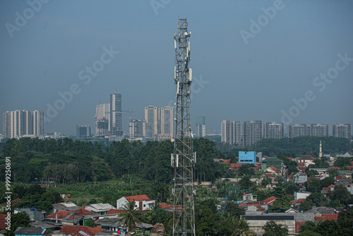 A cellular transmitter tower in a city.
