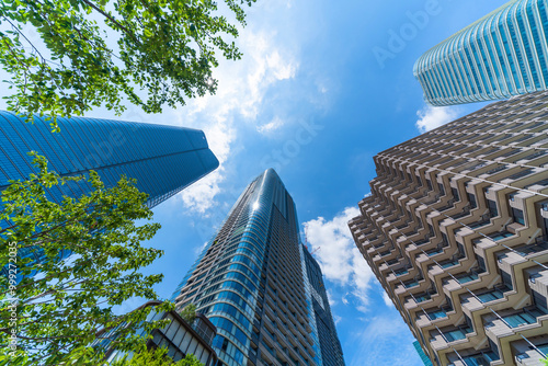 looking up view of city skyline in tokyo, japan photo