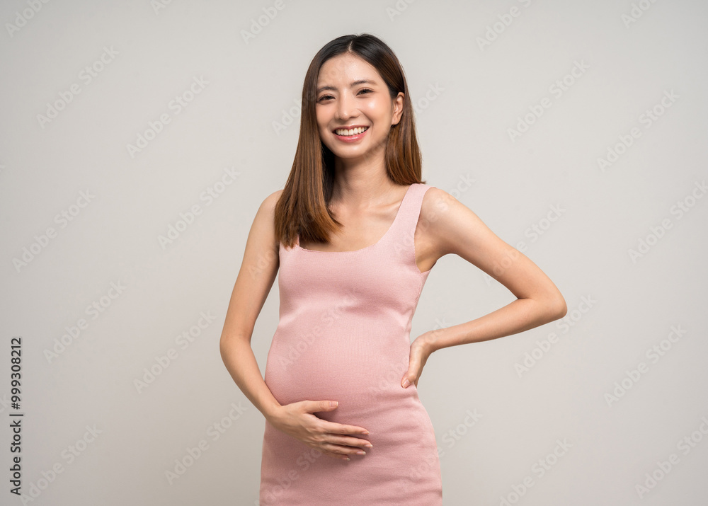 Happy Pregnant asian woman stroking touch belly motherhood on isolated background. Family planning maternity and pregnancy with insurance for child health. Happy Pregnant asian woman stroking touch belly motherhood on isolated background. Family planning maternity and pregnancy with insurance for child health.