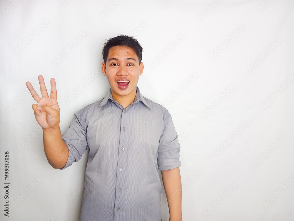 Adult Asian man smiling happy while standing and give 1,2,3,4,5 sign wearing grey shirt isolated on white background
Adult Asian man smiling happy while standing and give 1,2,3,4,5 sign wearing grey shirt isolated on white background