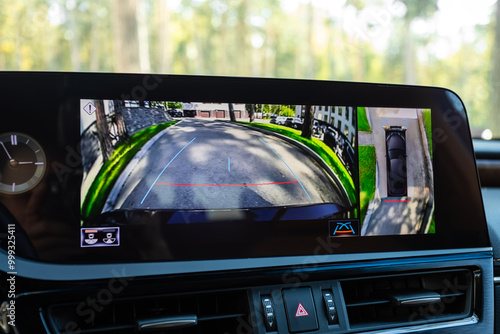 Close-up of monitor with view from reversing camera with parking in park area photo