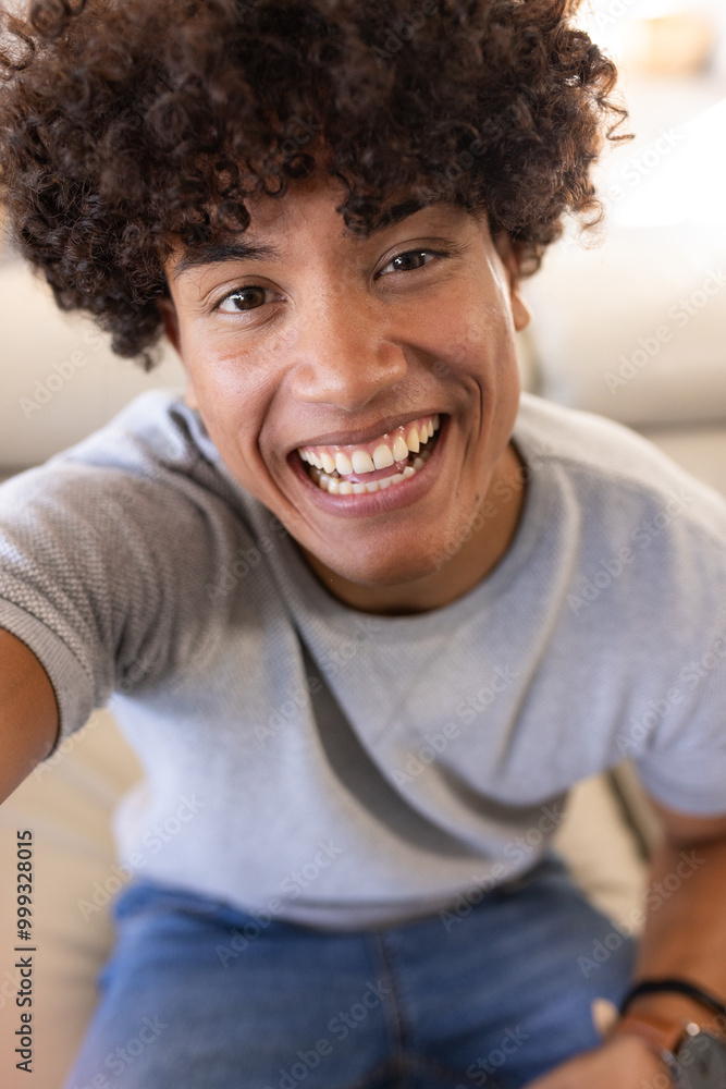 Obraz premium On video call, Smiling young man, enjoying moment, at home