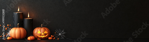 Halloween decorations, pumpkins and candles on dark background.