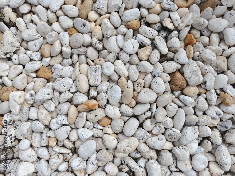 White and Beige Pebbles Texture: A close-up image of smooth, white and beige pebbles, creating a natural, textural background. Perfect for design projects, websites, and presentations. White and Beige Pebbles Texture: A close-up image of smooth, white and beige pebbles, creating a natural, textural background. Perfect for design projects, websites, and presentations.