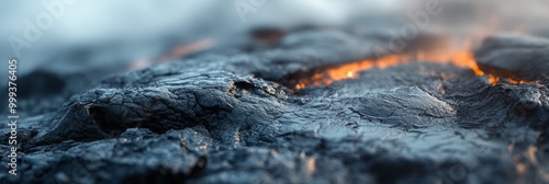 Volcanic Rock Textures with Blurred Landscape, intricate details of volcanic rock amidst a softly blurred backdrop of a rugged volcanic terrain photo