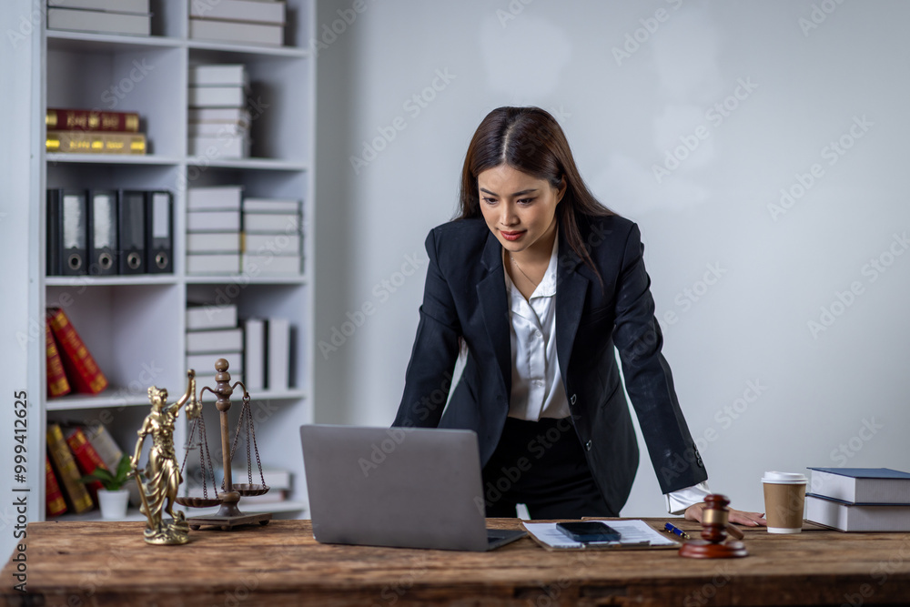 Fototapeta premium Lawyer business woman working with law books in the office or courtroom Legal counsel with gavel and legal law. justice and lawyer concept Judge gavel hammer on Lawyer desk 