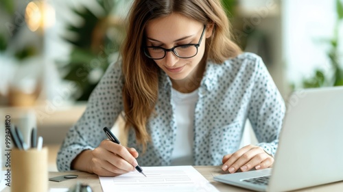 Professional filling out a job application online, focused and excited for the career possibilities ahead job application, career pursuit