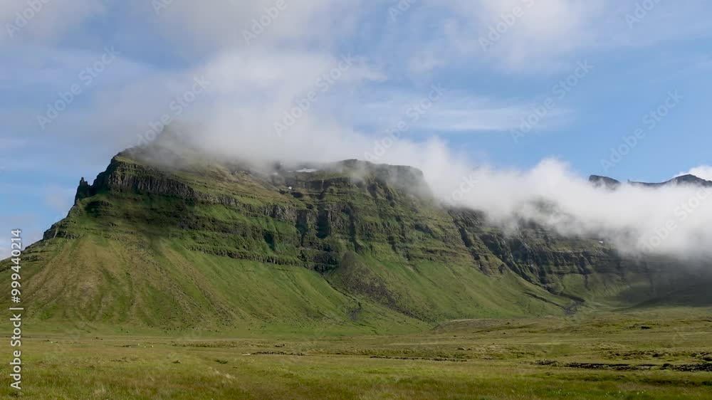 Aerial drone view of the Icelandic highlands at sunrise, showcasing mist-covered green fields, distant mountains, and soft sunlight over the landscape. Aerial drone view of the Icelandic highlands at sunrise, showcasing mist-covered green fields, distant mountains, and soft sunlight over the landscape.