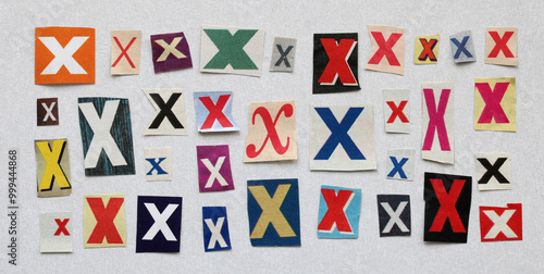 The letter X. a collection of paper pieces cut from a magazine.