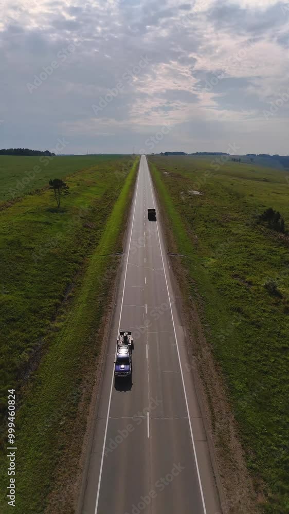 The car is driving along the road The car is driving along the road