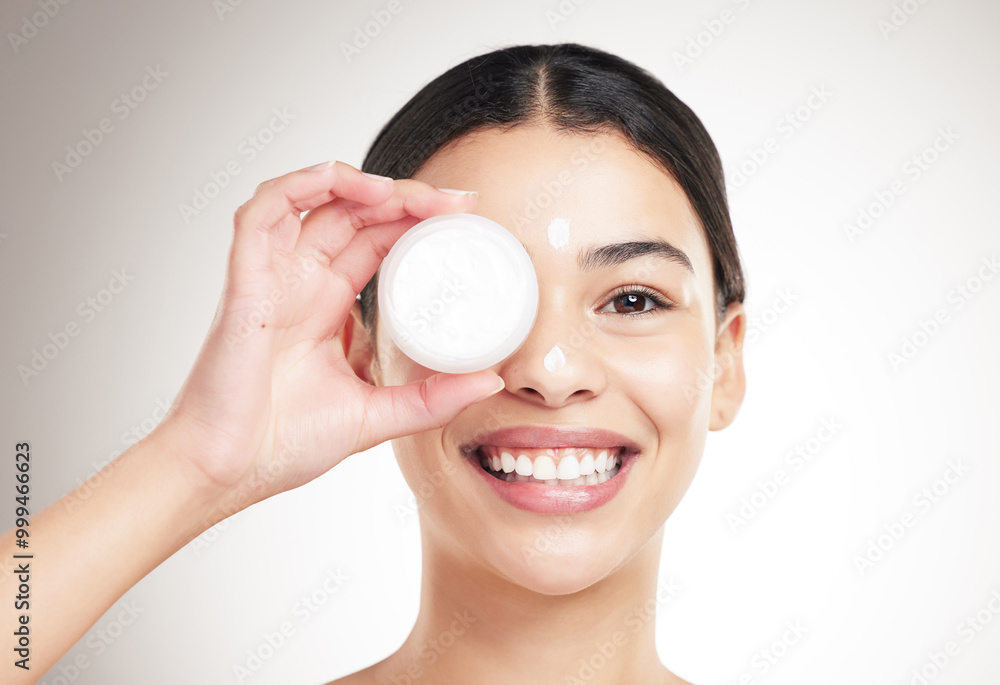 Portrait, woman and cream for skincare in studio with facial care, collagen treatment and dermatology glow. Smile, girl and lotion product for aesthetic, beauty and moisturiser on gray background Portrait, woman and cream for skincare in studio with facial care, collagen treatment and dermatology glow. Smile, girl and lotion product for aesthetic, beauty and moisturiser on gray background