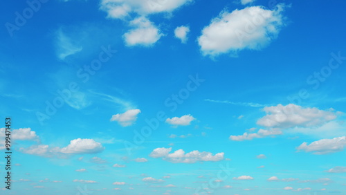 Sunny And Windy Weather Sky With Blue Tones. Cloud Is Aerosol Comprising Visible Mass Of Liquid Droplets.