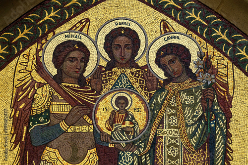 Mosaic of The three archangels, Saint Michael, Saint Gabriel, and Saint Raphael surrounding and protecting Jesus.