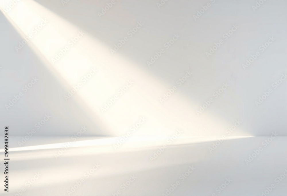 White wall with soft light streaks and shadow.