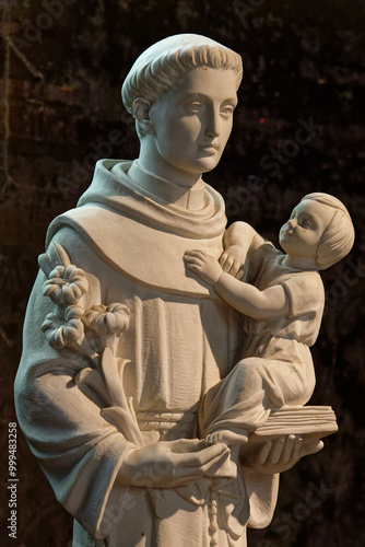 Statue of Saint Anthony of Padua or Saint Antoine de Padoue holding baby Jesus Christ in her arms. Saint of the Roman Catholic.. photo