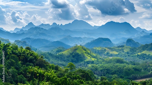 Thai landscape with mountains and verdant trees in the distance with a blue sky and clouds in the sky