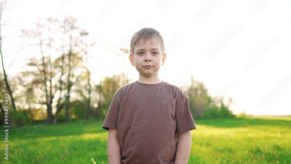little boy outdoor portrait. happy family kid a dream concept. child close-up in the park lifestyle in nature looking to the side. boy kid portrait in the background grass forest park little boy outdoor portrait. happy family kid a dream concept. child close-up in the park lifestyle in nature looking to the side. boy kid portrait in the background grass forest park