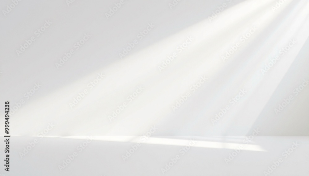 A white background with diagonal rays of light streaming down. A white background with diagonal rays of light streaming down.