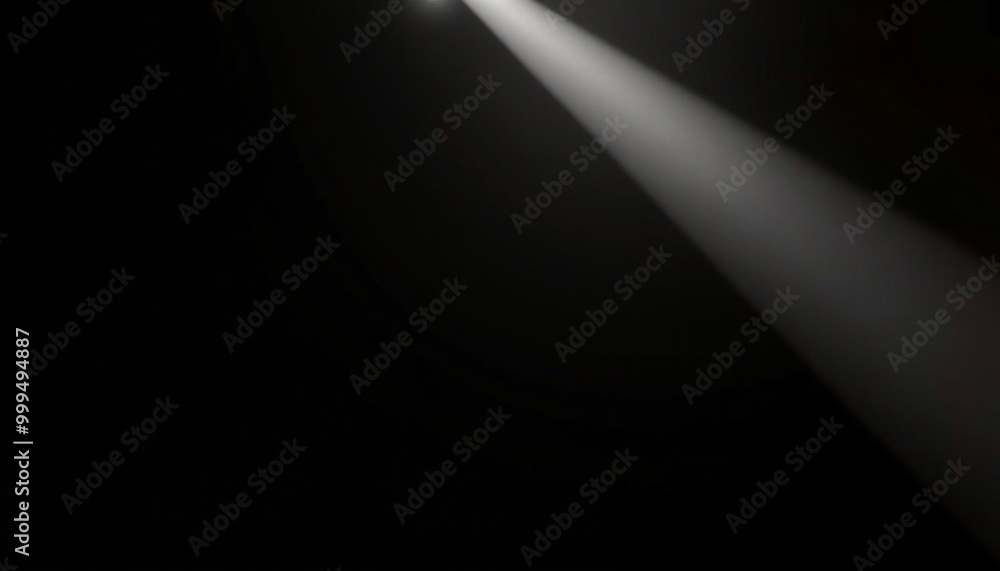 A single, bright spotlight beam cuts through a dark background. A single, bright spotlight beam cuts through a dark background.