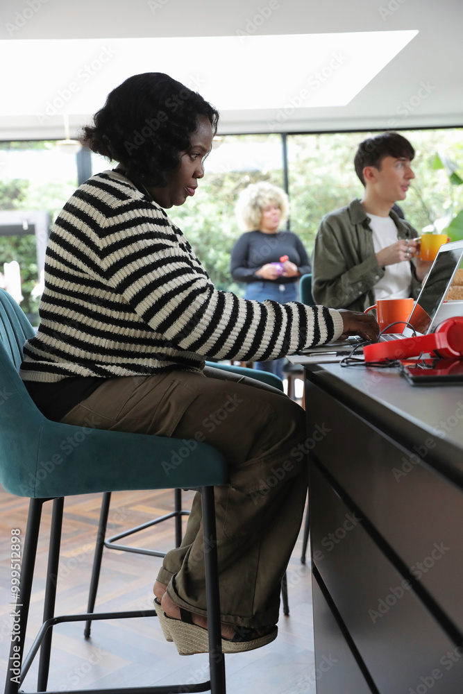 Woman using laptop at home Woman using laptop at home