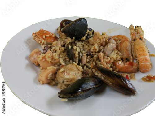 Close-up of a traditional seafood paella, featuring a rich mix of rice, prawns, mussels, clams, and squid. A classic Spanish dish known for its vibrant flavors and Mediterranean ingredients