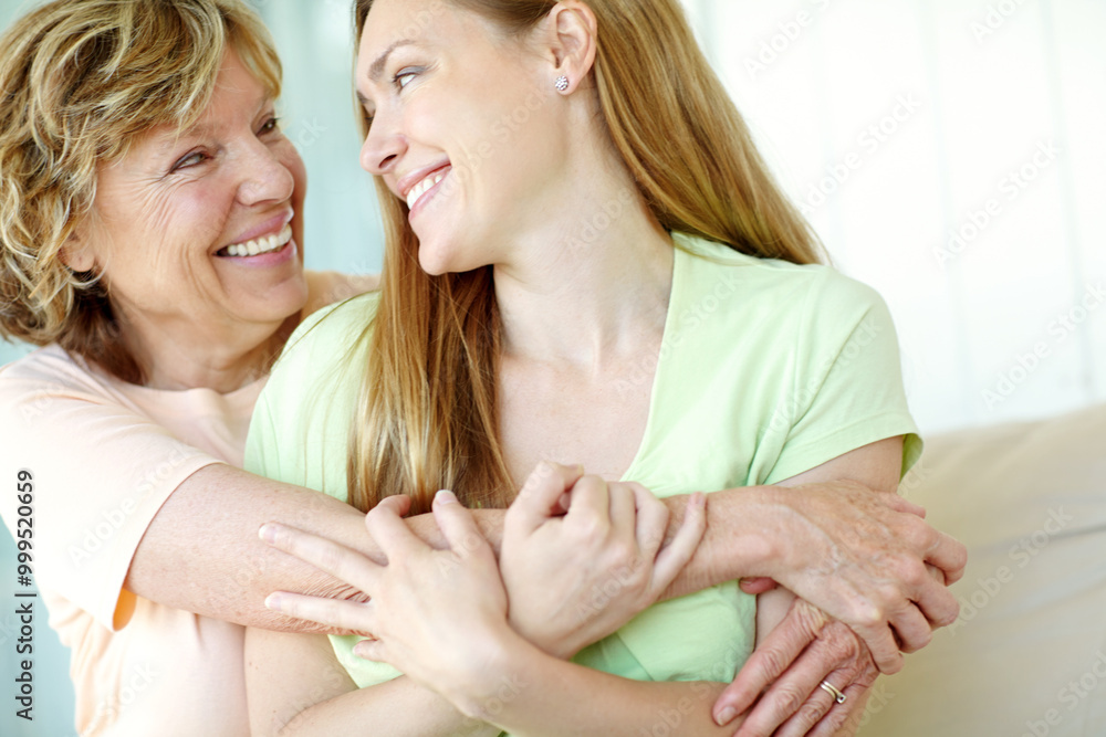 Hug, mature mother and daughter on sofa with happy bonding, smile and morning care in living room together. Relax, senior mom and girl embrace on couch with love, support and gratitude in family home Hug, mature mother and daughter on sofa with happy bonding, smile and morning care in living room together. Relax, senior mom and girl embrace on couch with love, support and gratitude in family home