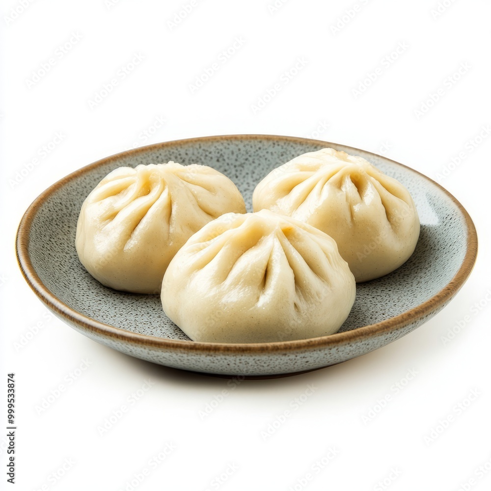 stuffed steamed bun on the plate isolated on white background. stuffed steamed bun on the plate isolated on white background.