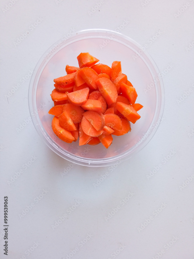 Carrot slices ready to be cooked isolate on white Carrot slices ready to be cooked isolate on white