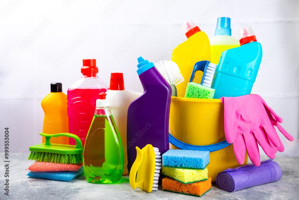 Cleaning service concept.Home cleaning product on a pink background. Bucket with household chemicals. cleaning supplies for home or office space.Early spring regular cleaning. Copy space Cleaning service concept.Home cleaning product on a pink background. Bucket with household chemicals. cleaning supplies for home or office space.Early spring regular cleaning. Copy space