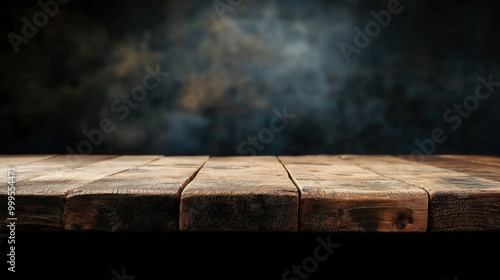 Empty wooden table with dark background for product display or presentation