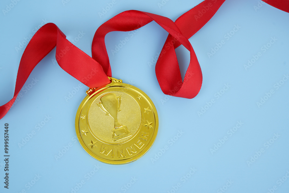 Gold medal with champion cup and red ribbon on blue background. Gold medal with champion cup and red ribbon on blue background.