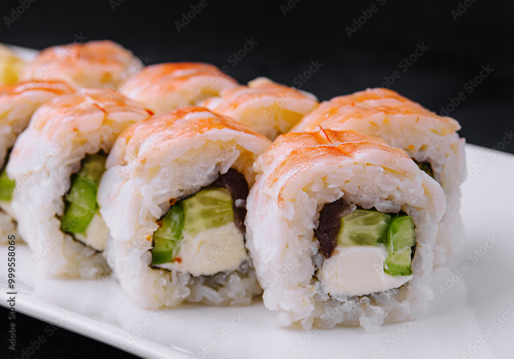 Fresh sushi roll platter on elegant white dish Fresh sushi roll platter on elegant white dish